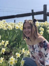 Color image of Jess Dominick in a field of flowers.